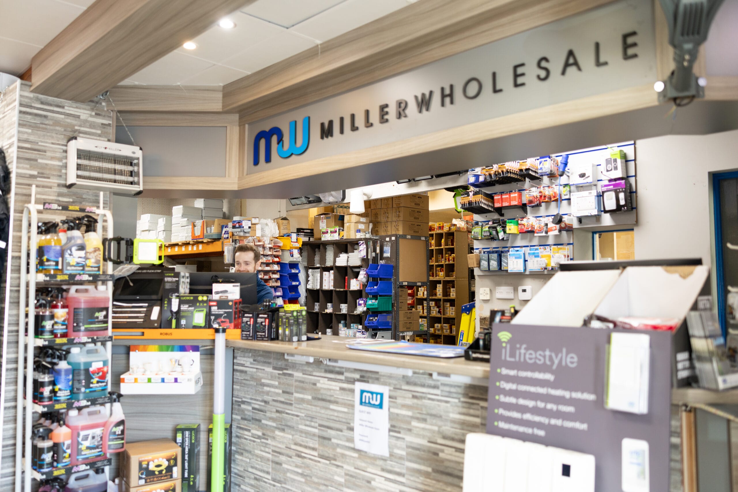 Miller Wholesale checkout desk with electrical, car cleaning products and stock room