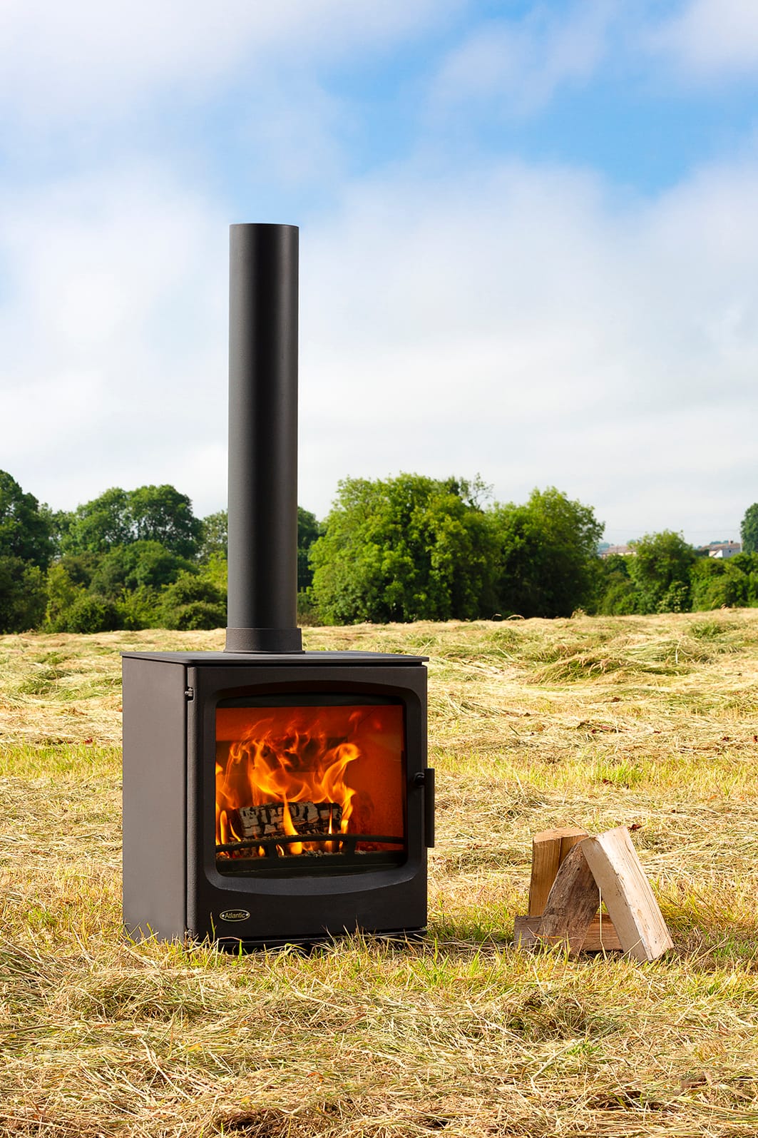 Atlantic Pearl 8 stove lit outdoors, suited to larger living rooms