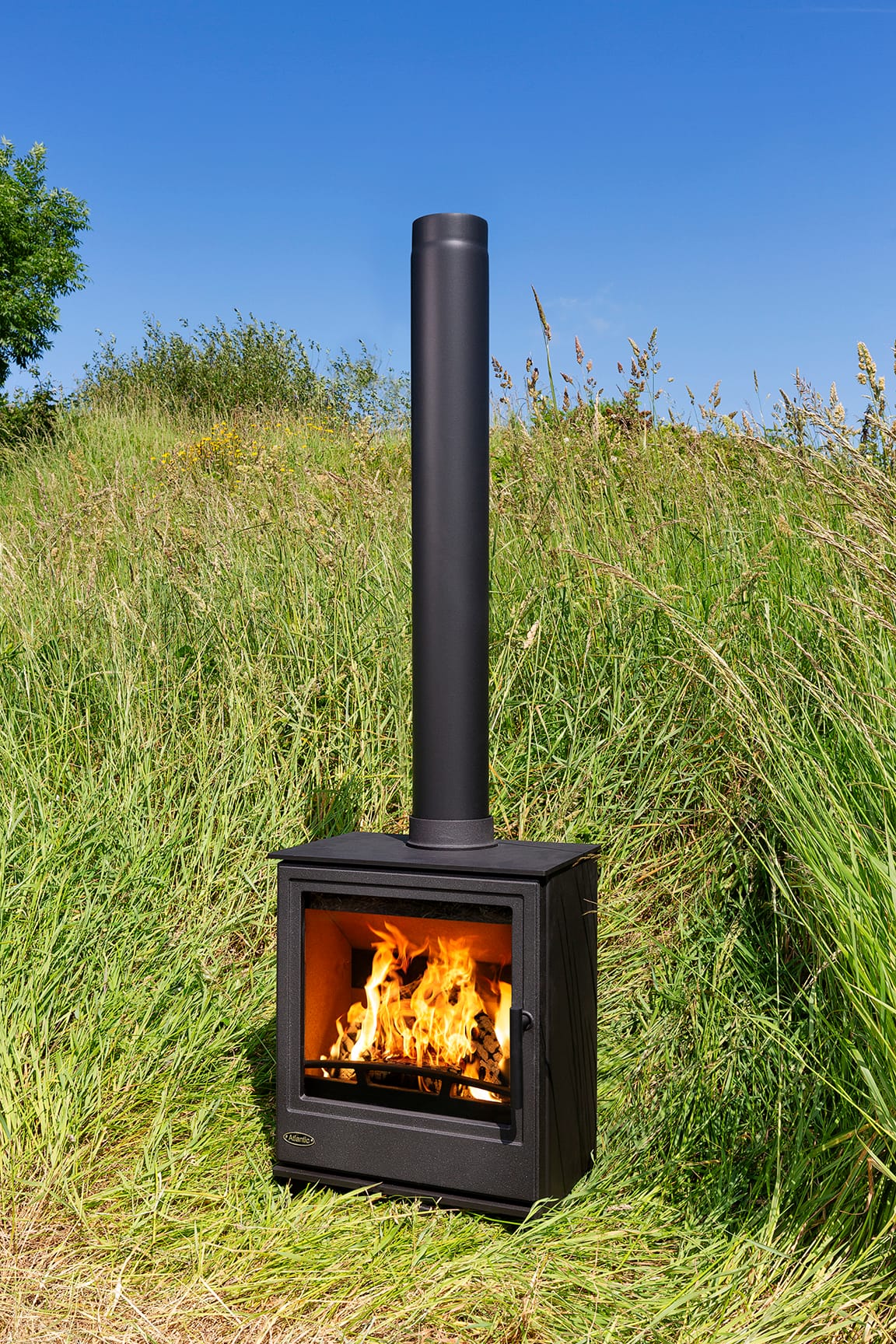 Atlantic Shore 7 stove with a tall glass door and burning fire